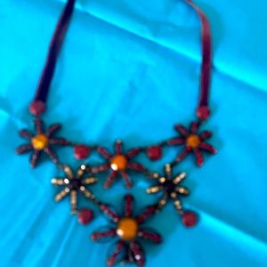 Lovely brown choker featuring flowers with a velvet band